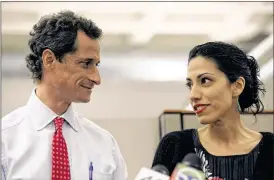  ?? JOHN MOORE / GETTY IMAGES 2013 ?? Top Hillary Clinton aide Huma Abedin, shown in 2013 with her husband, former U.S. Rep. Anthony Weiner, announced Monday that she is separating from Weiner in the wake of new reports that he sent lewd messages to women online.