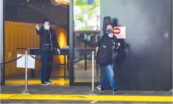  ??  ?? Lee (right) leaving her hotel following the completion of her three-weeks of mandatory quarantine in Hong Kong.