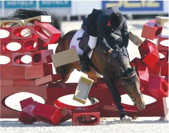  ??  ?? John Whitaker somehow stays on board Peppermill to help Britain secure a bronze in 2011