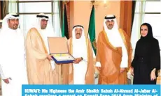  ?? — KUNA photos ?? KUWAIT: His Highness the Amir Sheikh Sabah Al-Ahmad Al-Jaber AlSabah receives a report on Kuwait Expo 2018 from Minister of Commerce and Industry Khaled Al-Roudhan.