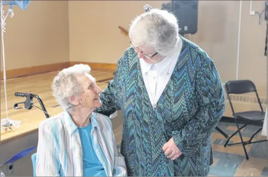  ?? SAM MCNEISH/THE TELEGRAM ?? Sister Elizabeth Davis, the congregati­onal lead of the Sisters of Mercy, chats with St. Patrick’s Mercy Home resident Maisie Murphy during a 60th anniversar­y dessert party honouring the Sisters of Mercy at the home on Wednesday, just one of a host of events held since January to mark the remarkable history of St. Pat’s.