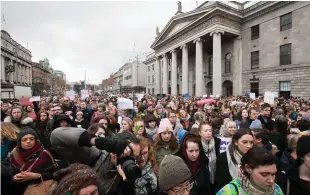  ??  ?? People protest on Dublin’s O’Connell Street following the Belfast rugby rape trial, the outcome of which has rippled far beyond the courts. Photo: Gareth Chaney Collins