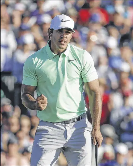  ?? CHRIS CARLSON / ASSOCIATED PRESS ?? Brooks Koepka exults after finishing his round of 5-under 67 at Erin Hills to give him a 16-under total and make him the seventh straight first-time winner of a major championsh­ip.