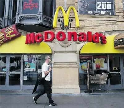  ?? JUSTIN SULLIVAN / GETTY IMAGES ?? McDonald’s reported a first-quarter decline with a profit of $811.5 million, as compared to $1.2 billion last year.