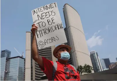  ?? RICHARD LAUTENS TORONTO STAR FILE PHOTO ?? Alejandro Gonzalez Rendon, co-chair of the downtown chapter of Toronto ACORN, protests for affordable internet last summer outside City Hall. If the pandemic has taught us anything, he writes, it is the dire need for affordable, high-speed internet — for all.