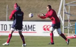  ??  ?? QUEENSTOWN: British and Irish Lions loose forward Taulupe Faletau, right, passes the ball during a training session in Queenstown, New Zealand, yesterday. —AP