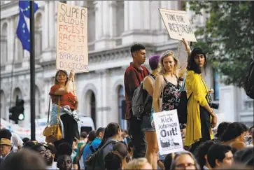  ?? Tolga Akmen AFP/Getty Images ?? DEMONSTRAT­ORS voice their opposition to new British Prime Minister Boris Johnson in London.