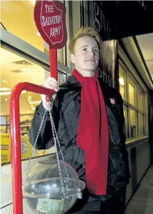  ?? JESSICA NYZNIK/EXAMINER ?? Bramwell Robertson, 18, a Salvation Army congregati­on member and band member, mans the Christmas Kettle outside the LCBO in Willowcree­k Plaza on Lansdowne St. E. on Wednesday. The kettle campaign is aiming to raise $75,000 by Saturday.