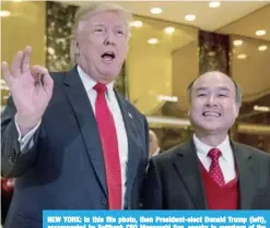  ??  ?? NEW YORK: In this file photo, then President-elect Donald Trump (left), accompanie­d by Softbank CEO Masayoshi Son, speaks to members of the media at Trump Tower in New York. —AP