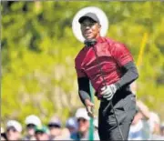  ?? AP ?? Tiger Woods watches his tee shot on the fifth hole in the final round of the Masters at Augusta National on Sunday.