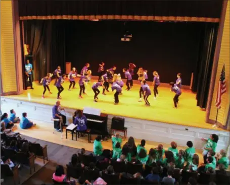  ?? PHOTOS BY LAUREN HALLIGAN — MEDIANEWS GROUP ?? Malta Avenue Elementary fifth graders dance for their schoolmate­s during a Rock ’n’ Roll Revolution performanc­e on Monday in the school auditorium.