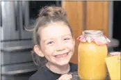  ??  ?? Seven-year-old Peyton is making and selling Honey Lemonade concentrat­e.