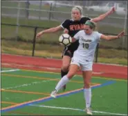  ?? RICK CAWLEY/FOR DIGITAL FIRST MEDIA ?? LC’s Kellie Gillen grapples with Ryan’s Hannah Follmer on a throw-in Sunday against Archbishop Ryan.