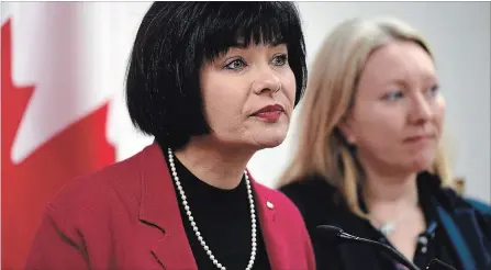  ?? JUSTIN TANG THE CANADIAN PRESS ?? Minister of Health Ginette Petitpas Taylor listens to a question during the announceme­nt , as Liberal MP for Ottawa-Vanier Mona Fortier looks on.