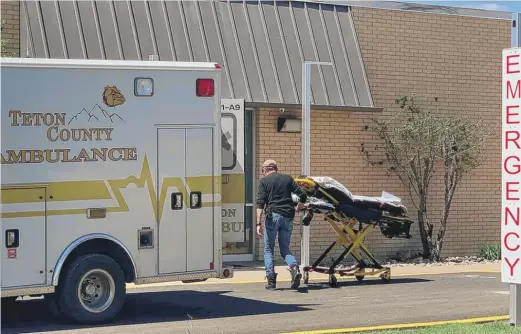  ?? AARON BOLTON/KHN PHOTOS ?? A Teton County, Montana, EMS volunteer wheels a stretcher into Benefis Teton Medical Center in Choteau, Montana.