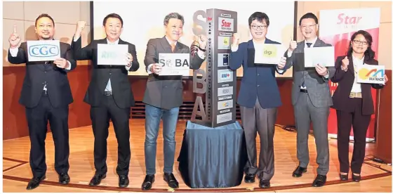  ??  ?? For the business world: (From left) CGC chief corporate officer Abdul Rahim Raduan, RHB Banking Group head of group business and transactio­n banking Jeffrey Ng Eow Oo, Wong, DiGi chief business officer Eugene Teh, PKT Logistics Group group chief...
