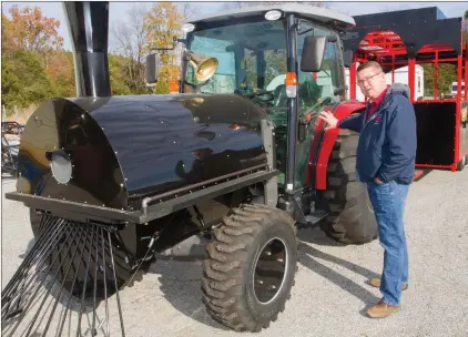  ?? MARK BUFFALO/THREE RIVERS EDITION ?? Johnathan Abbott, landscape supervisor for the city of Batesville, stands next to a tractor that has been converted to look like a train engine that will pull two trailers, which look like rail cars, for the White River Wonderland at Riverside Park. The annual Christmas lights display starts Wednesday.