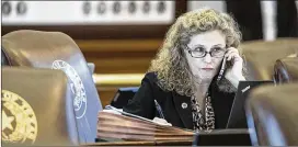  ?? RICARDO B. BRAZZIELL / AMERICAN-STATESMAN ?? State Rep. Donna Howard, D-Austin, listens on the phone Thursday. Texas became the 11th of the 34 states needed to call the convention.