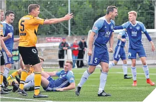  ??  ?? Peterhead’s David McCracken celebrates his equaliser.