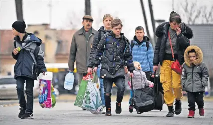  ?? ?? Displaced Refugees fleeing the violence in Ukraine