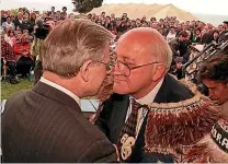  ??  ?? Prime Minister Jim Bolger and Ngai Tahu leader Sir Tipene O’Regan hongi after signing the Ngai Tahu deed of settlement at Takahanga Marae in Kaikoura.