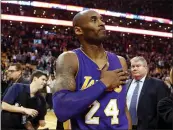  ?? WINSLOW TOWNSON — THE ASSOCIATED PRESS FILE ?? Los Angeles Lakers’ Kobe Bryant touches his chest as he walks off the court in Boston after the Lakers’ 112-104 win over the Boston Celtics on Dec. 30, 2015. Tuesday marked the anniversar­y of the crash that took the lives of Bryant, his daughter Gianna and seven other people.