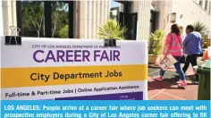  ?? ?? LOS ANGELES: People arrive at a career fair where job seekers can meet with WYVZWLJ[P]L LTWSV`LYZ K\YPUN H *P[` VM 3VZ (UNLSLZ JHYLLY MHPY VMMLYPUN [V ÄSS ]HJHUJPLZ PU TVYL [OHU JSHZZPÄJH[PVUZ VM QVIZ VU 5V]LTILY PU 3VZ Angeles, California. — AFP