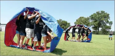  ?? NWA Democrat-Gazette/J.T. WAMPLER ?? Teams compete Thursday during LIFE Olympics at Northwest Arkansas Community College’s LIFE program in Bentonvill­e. Students in the program come from the Bentonvill­e, Fayettevil­le, Gentry, Pea Ridge, Rogers and Springdale districts. The three-day...