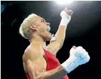  ?? PHOTOS: GETTY IMAGES ?? David Nyika celebrates winning his 91kg semifinal against England’s Cheavon Clarke.