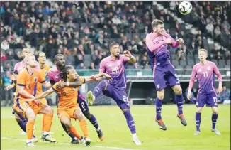  ?? ?? Germany’s Pascal Gross (2nd right), leaps up for a header during the internatio­nal friendly soccer match between Germany and Netherland­s at the Deutsche Bank Park in Frankfurt, Germany. (AP)