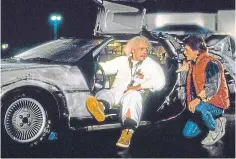  ??  ?? Christophe­r Lloyd, left, and Michael J Fox with a Delorean in Back To The Future.