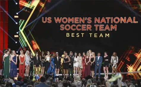  ?? Associated Press ?? After being feted with a ticker- tape parade Wednesday morning in New York, the U. S. women’s soccer team made it to Los Angeles by Wednesday night to receive the award for best team at ESPN’s ESPY Awards.