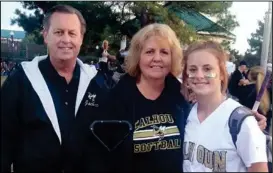  ?? CONTRIBUTE­D PHOTO ?? Alvin Long (left) is pictured with his wife Pat (center) and granddaugh­ter Tori Roper at one of Tori’s Calhoun High softball games.