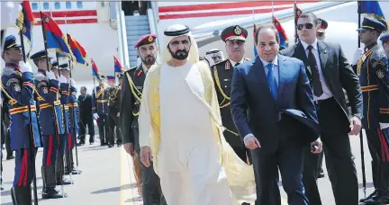  ?? EGYPTIAN PRESIDENCY/THE ASSOCIATED PRESS ?? Egyptian president Abdel-Fattah el-Sissi, right, receives United Arab Emirates’ ruler Sheik Mohammed bin Rashid al-Maktoum at the airport in Sharm elSheik on Friday before an internatio­nal conference to promote his recovery plan for Egypt’s economy.