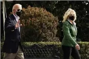  ?? ANDREW HARNIK — THE ASSOCIATED PRESS ?? President Joe Biden and first lady Jill Biden walk across the South Lawn to board Marine One at the White House in Washington.