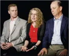  ?? BEBETO MATTHEWS — THE ASSOCIATED PRESS FILE ?? In this file photo, Evelyn Piazza, center, seated with husband James, right, and son Michael, left, speaks during an interview in New York. The Piazzas talked about Timothy Piazza, 19, a brother, son and Penn State sophomore who died in February after...