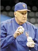  ?? AP ?? Phil Regan, an assistant minor league pitching coordinato­r, throws batting practice to Mets at Citi Field one day after turning 80, a personal dream come true.