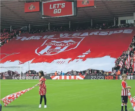  ?? ?? Sunderland fans show their support with a flag display at the Stadium of Light. Picture by Frank Reid