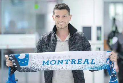 ?? PAUL CHIASSON/THE CANADIAN PRESS ?? Swiss internatio­nal Blerim Dzemaili shows his new team’s colours upon arriving at in Montreal on Tuesday.