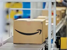  ?? DAVID ZALUBOWSKI THE ASSOCIATED PRESS FILE PHOTO ?? Amazon’s paid subscripti­on service provides free delivery for online shopping across Canada, except for remote locations. While customers in Iqaluit qualify for the offer, all other communitie­s in Nunavut are excluded.