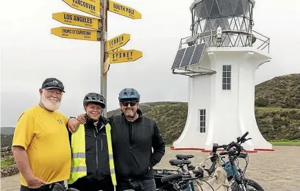  ?? ?? Rod Rutherford, left, was joined by wife Karen and brother Arty for the last four days of his ride, ending at Cape Reinga in late July.