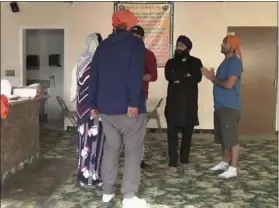  ?? THE ASSOCIATED PRESS ?? Asylum-seekers at the U.S.-Mexico border were detained for months in a federal prison in Oregon because of overcrowde­d immigratio­n facilities. Now, they’re free on bond and are being helped by a Sikh temple in Salem, Oregon.