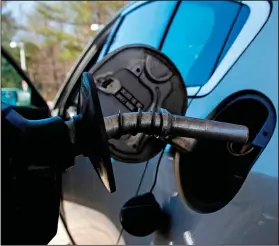  ?? Charles Krupa/AP ?? Gas station: In this April 23, 2018, photo, a car is filled with gasoline at a station in Windham, N.H. Crude oil prices are at the highest level in more than three years and expected to climb higher, pushing up gasoline prices along the way.