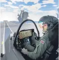  ??  ?? Test pilot Andy Edgell uses a jet simulator.