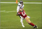  ?? RANDY VASQUEZ — BAY AREA NEWS GROUP ?? Eagles quarterbac­k Carson Wentz (11), left, gets hit by the 49ers’ Fred Warner during the second quarter in October of 2020 at Levi’s Stadium in Santa Clara.