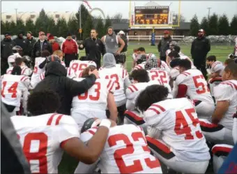  ?? PETE BANNAN — DIGITAL FIRST MEDIA ?? Coatesvill­e coach Matt Ortega talks to his players after Saturday’s loss to Harrisburg.