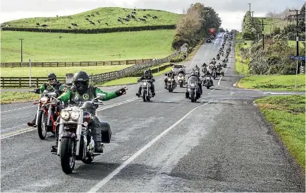  ?? ANDY JACKSON/STUFF ?? A procession of motorbikes made its way through Inglewood on Friday morning before the funeral service for Tama ‘Eminukutep­ua.