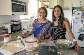  ?? PHOTO: DAVID WALKER/STUFF ?? The cookbook A Little Bit of This, A Little Bit of That was created by Jayshri Ganda, right, and her mother Laxmi Ganda.