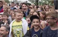  ?? JACQUES BOISSINOT/THE CANADIAN PRESS ?? Prime Minister Justin Trudeau in Sainte-Anne-de-la-Pérade, Que., on Friday. News that Quebec would for the first time get a share of the $2.4 million that Ottawa is spending on the June 24 festivitie­s barely caused a ripple.