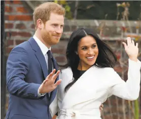  ?? Chris Jackson / Getty Images ?? Prince Harry and Meghan Markle pose for photograph­ers in London after announcing their engagement. The two plan to marry in the spring.